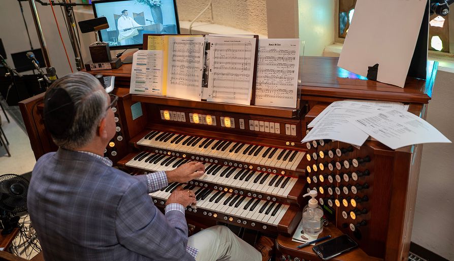 A man playing an organ
